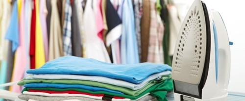 Iron Next To Folded Clothes Min